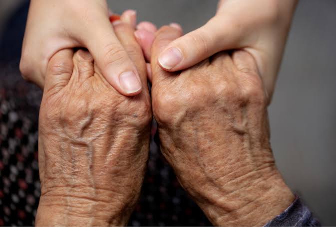Close detail of supportive hands